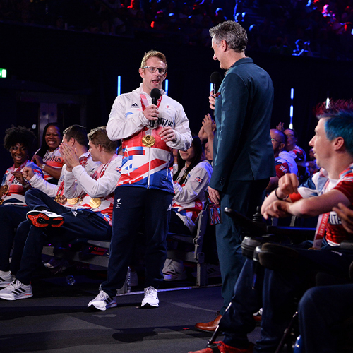 Two men addressing audience at Paralympics Team GB homecoming event at AO Arena