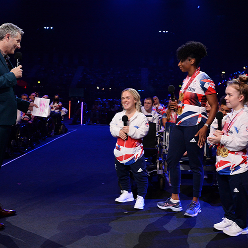 The host interviewing three paralympians at the National Lottery Homecoming event at AO Arena.